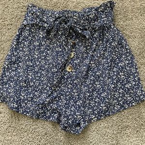 Francesca’s blue and white floral paper bag waist shorts with buttons